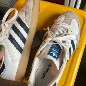 Navy blue and white sambas